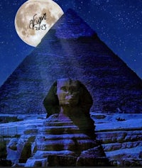 a sphinx and pyramids with a full moon in the background