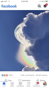 a photo of a rainbow in the sky with a rainbow in the background